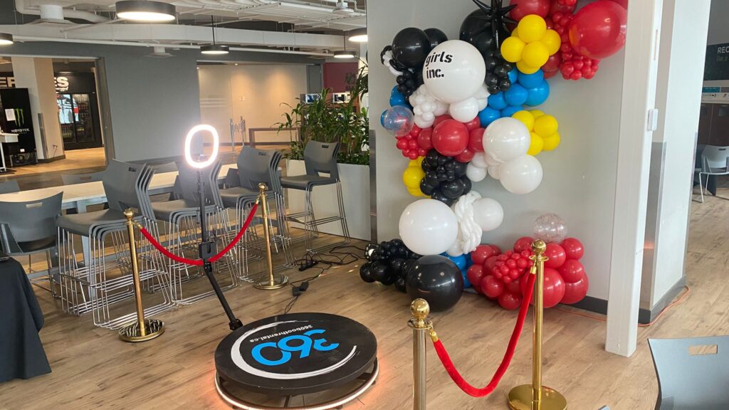 360 video booth with event furniture and balloon decor