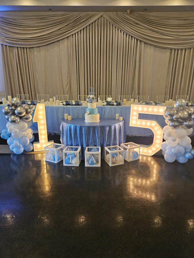 Balloon pillars, baby blocks and marquee numbers.
