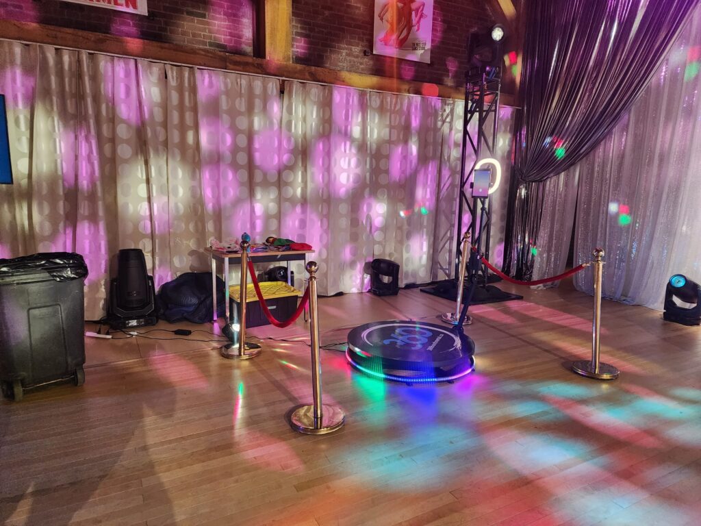 360 video booth with stanchions, drapes and props